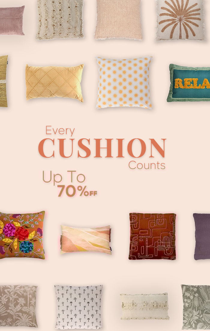 Cozy white bedding on a wooden stool, promoting winter sale with up to 50% off at Home Deco & More