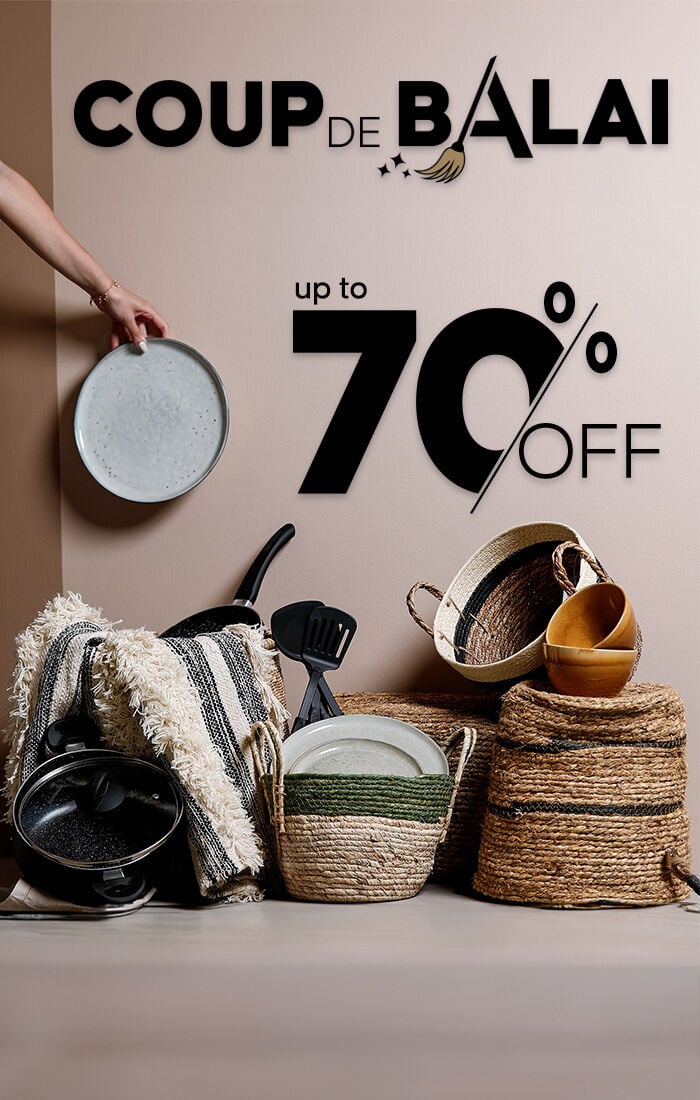 Cozy white bedding on a wooden stool, promoting winter sale with up to 50% off at Home Deco & More