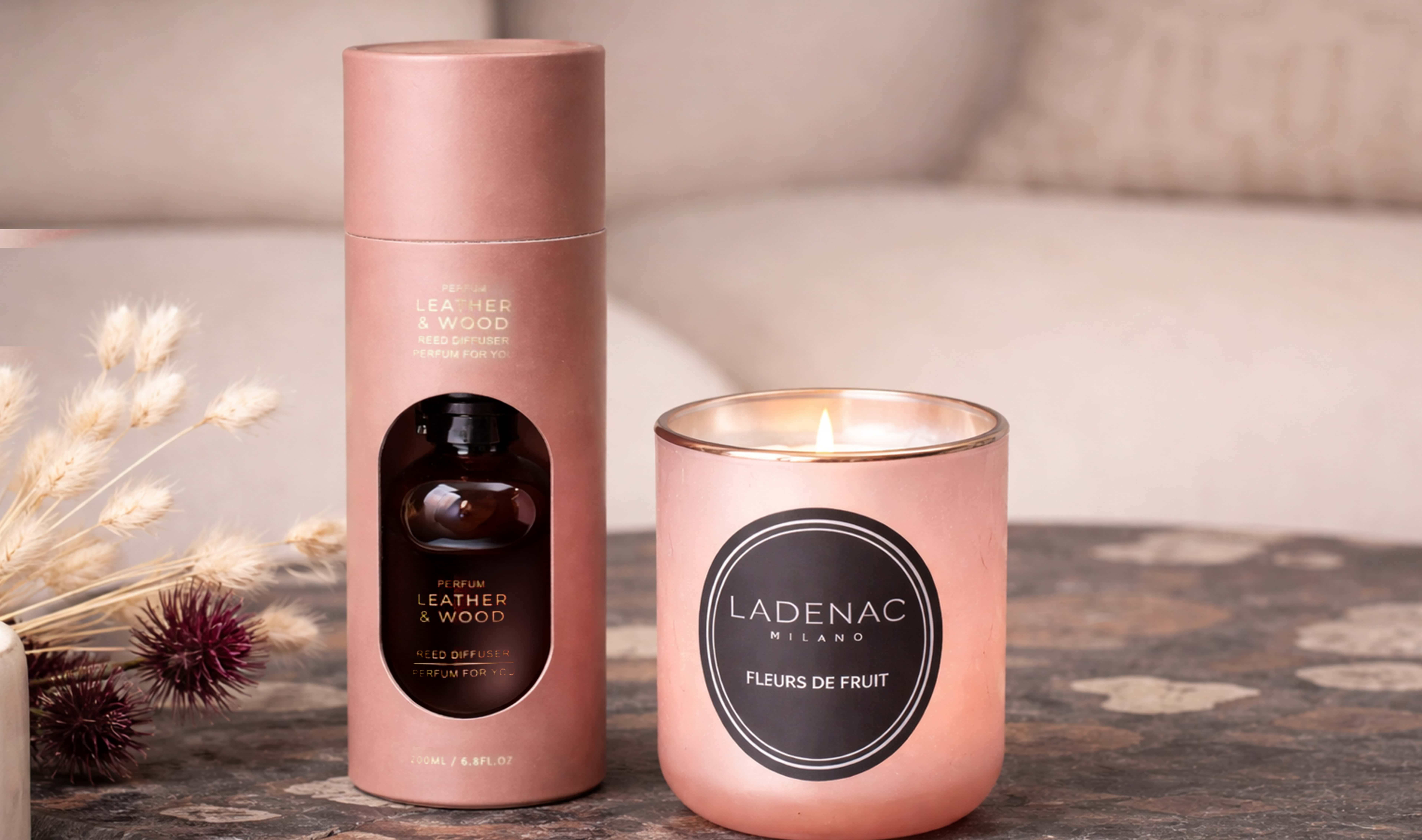 Decorative scented candle and home fragrance diffuser styled on a coffee table