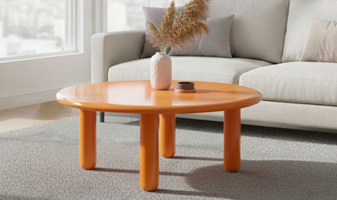 Modern neutral living room with upholstered sofas, wooden furniture, and warm decorative accents.