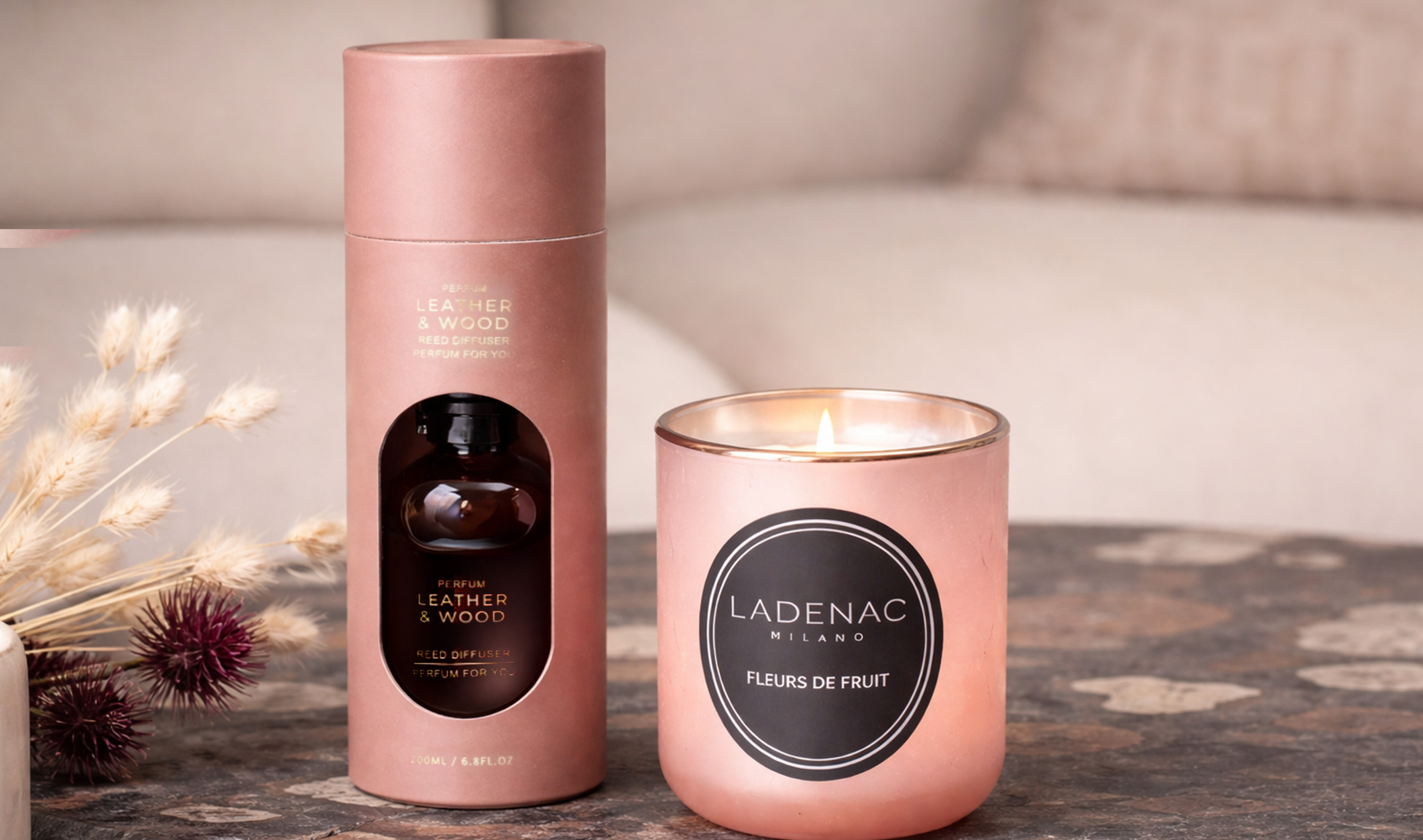 Decorative scented candle and home fragrance diffuser styled on a coffee table