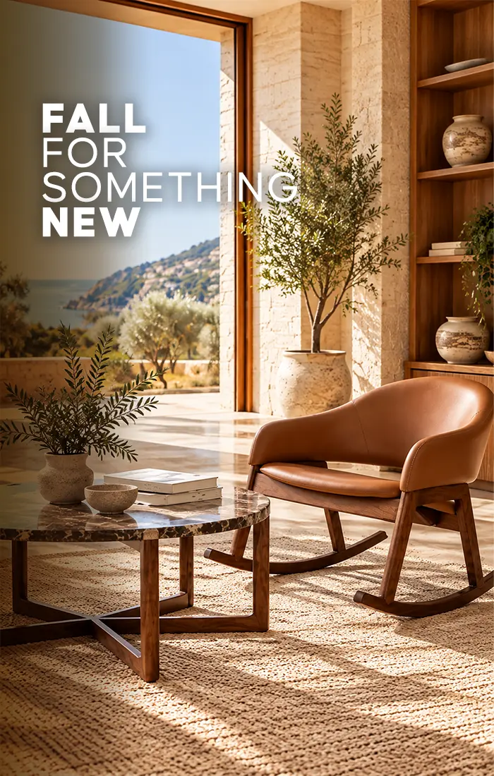 Wooden coffee table and brown rocking chair in a warm, sunlit living room