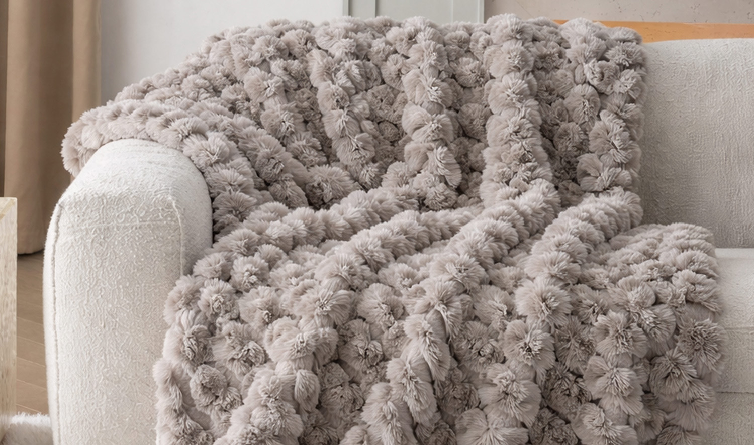 Statement blanket draped on armchair